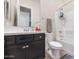 Clean bathroom with dark cabinets, bright white sink and bathtub, with modern fixtures and fittings at 10148 W Avenida Del Rey --, Peoria, AZ 85383