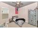 Stylish bedroom featuring a comfortable bed, American flag decoration, and industrial-style locker storage at 10148 W Avenida Del Rey --, Peoria, AZ 85383