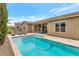 Backyard pool area featuring a large pool, lounge chairs, and a covered patio area with outdoor furniture at 10148 W Avenida Del Rey --, Peoria, AZ 85383