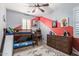 A playful room with bunk beds, red and gray accents, and a unique accent wall at 10451 E Natal Ave, Mesa, AZ 85209