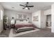 A beautiful main bedroom boasts a ceiling fan, neutral tones, and decor at 10451 E Natal Ave, Mesa, AZ 85209