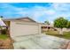 Ranch-style home showcasing a large garage and well-maintained front yard at 10516 W El Capitan Cir, Sun City, AZ 85351