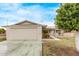 Ranch-style home showcasing a large garage and well-maintained front yard at 10516 W El Capitan Cir, Sun City, AZ 85351