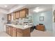 Kitchen featuring matching wooden cabinets with updated countertops, tile backsplash, and stainless steel appliances at 10516 W El Capitan Cir, Sun City, AZ 85351