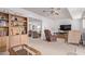 Comfortable living space with a ceiling fan and view to dining area at 10516 W El Capitan Cir, Sun City, AZ 85351