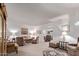 Bright living room with neutral tones and a view into other rooms at 10516 W El Capitan Cir, Sun City, AZ 85351