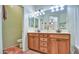 A bathroom features a double vanity with storage and a peach colored accent rug at 1155 S Annie Ln, Gilbert, AZ 85296