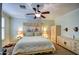 Cozy bedroom featuring a comfortable bed, two bedside tables, and an ornate dresser at 1155 S Annie Ln, Gilbert, AZ 85296