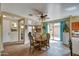 Well lit dining area with tile flooring and a sliding glass door provides natural light at 1155 S Annie Ln, Gilbert, AZ 85296