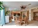 Inviting dining area and kitchen combo with neutral tile floors and stylish light fixture at 1155 S Annie Ln, Gilbert, AZ 85296