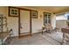 Cozy front porch with a seating area, perfect for relaxation, and charming decorative elements at 1155 S Annie Ln, Gilbert, AZ 85296