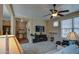 Bright living room with neutral decor, a ceiling fan, and an open feel, perfect for entertaining guests at 1155 S Annie Ln, Gilbert, AZ 85296