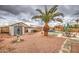 Spacious backyard featuring a pool, shed, palm tree, and outdoor seating area at 12450 W Holly St, Avondale, AZ 85392