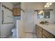 Well-lit bathroom with a toilet and a double sink vanity at 12450 W Holly St, Avondale, AZ 85392