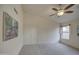 Bedroom featuring neutral walls, plush carpet, and a ceiling fan at 12450 W Holly St, Avondale, AZ 85392