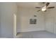 Vaulted bedroom offering neutral walls, ceiling fan, and a large closet at 12450 W Holly St, Avondale, AZ 85392