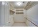 Walk-in closet featuring multiple shelves and bars for optimal storage at 12450 W Holly St, Avondale, AZ 85392