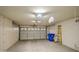 Spacious garage with ample storage cabinets and a large garage door, providing secure parking at 12450 W Holly St, Avondale, AZ 85392