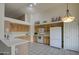 Bright eat-in kitchen with white countertops, classic cabinetry, and modern appliances for cooking at 12450 W Holly St, Avondale, AZ 85392