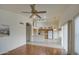 Bright kitchen and living room with laminate flooring and ample natural light at 12450 W Holly St, Avondale, AZ 85392