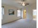 Spacious main bedroom with carpeted floors, bright windows, and ensuite bathroom at 12450 W Holly St, Avondale, AZ 85392