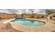 Inviting swimming pool with blue tile accents and well-maintained landscaping at 12450 W Holly St, Avondale, AZ 85392