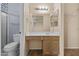 Bathroom featuring a vanity with storage, a large mirror, and great lighting for your everyday needs at 12454 W Redfield Rd, El Mirage, AZ 85335