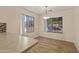 Dining area featuring bright natural light, wood floors and fresh paint at 12454 W Redfield Rd, El Mirage, AZ 85335