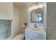 Well-lit bathroom showcasing a vanity with a modern faucet and stylish lighting fixture at 1320 E Bethany Home Rd # 104, Phoenix, AZ 85014