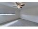 Neutral bedroom features a ceiling fan and light gray wood-look tile flooring at 1320 E Bethany Home Rd # 104, Phoenix, AZ 85014