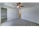 Neutral bedroom with wood-look tile flooring and an open closet at 1320 E Bethany Home Rd # 104, Phoenix, AZ 85014