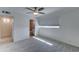 Bright bedroom featuring an ensuite bathroom, complemented by wood-look tile flooring at 1320 E Bethany Home Rd # 104, Phoenix, AZ 85014