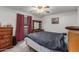 Bedroom with carpet, standard furnishings, window with curtains and a ceiling fan at 14013 N Boswell Blvd, Sun City, AZ 85351