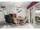 Dining area features bright tile floor, patio access, and a chandelier overhead at 14013 N Boswell Blvd, Sun City, AZ 85351