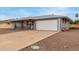 Charming single-story home with gray brick, low maintenance yard and two car garage at 14013 N Boswell Blvd, Sun City, AZ 85351