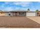 Charming single-story home with gray brick, low maintenance yard and two car garage at 14013 N Boswell Blvd, Sun City, AZ 85351