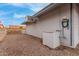 Exterior shot shows the side of the home and a glimpse into the backyard at 14013 N Boswell Blvd, Sun City, AZ 85351