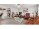 Cozy living room with carpet flooring, ceiling fan, and vintage cabinetry at 14013 N Boswell Blvd, Sun City, AZ 85351