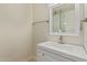 Bathroom featuring a vanity with a modern sink and a mirror reflecting the shower at 14024 N Palm Ridge Dr, Sun City, AZ 85351