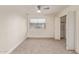 Cozy carpeted bedroom includes a window and closet for optimal comfort and storage at 14024 N Palm Ridge Dr, Sun City, AZ 85351