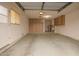 Spacious garage with built-in cabinets and ample storage space, ready for your vehicles and projects at 14024 N Palm Ridge Dr, Sun City, AZ 85351