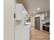 Modern kitchen with white cabinets, stainless steel appliances, and quartz countertops at 14024 N Palm Ridge Dr, Sun City, AZ 85351