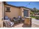 Outdoor patio featuring stylish seating arrangements around a modern fire pit at 14870 W Aldea Cir, Litchfield Park, AZ 85340