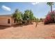 Backyard with desert landscaping and a home's exterior at 14932 W Lamoille Dr, Surprise, AZ 85374