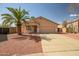 Charming single-story home featuring a well-maintained lawn and desert landscaping at 14932 W Lamoille Dr, Surprise, AZ 85374