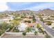 Stunning aerial view showcasing the house and surrounding community with mountain views at 15327 E Thistle Dr, Fountain Hills, AZ 85268