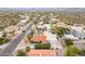 Aerial shot of the neighborhood displaying the home with a pool and well-kept landscaping at 15327 E Thistle Dr, Fountain Hills, AZ 85268