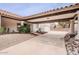 Spacious driveway with covered parking and lush desert landscaping at 15327 E Thistle Dr, Fountain Hills, AZ 85268