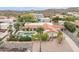 Inviting home featuring a sparkling pool, lush landscaping, and an attached covered carport at 15327 E Thistle Dr, Fountain Hills, AZ 85268