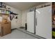 Additional garage storage space featuring two fridges and extra shelving at 15327 E Thistle Dr, Fountain Hills, AZ 85268